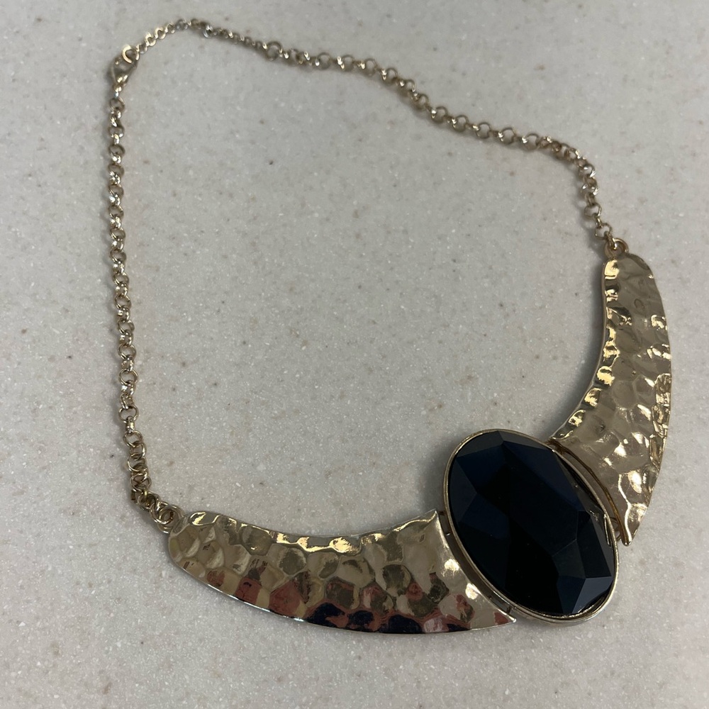 Gold necklace with black stone